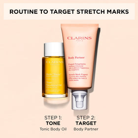 Clarins Body Partner tube next to everyday items to show size and travel-friendly benefit
