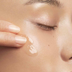Clarins bottle label detail emphasizing natural plant extract ingredients