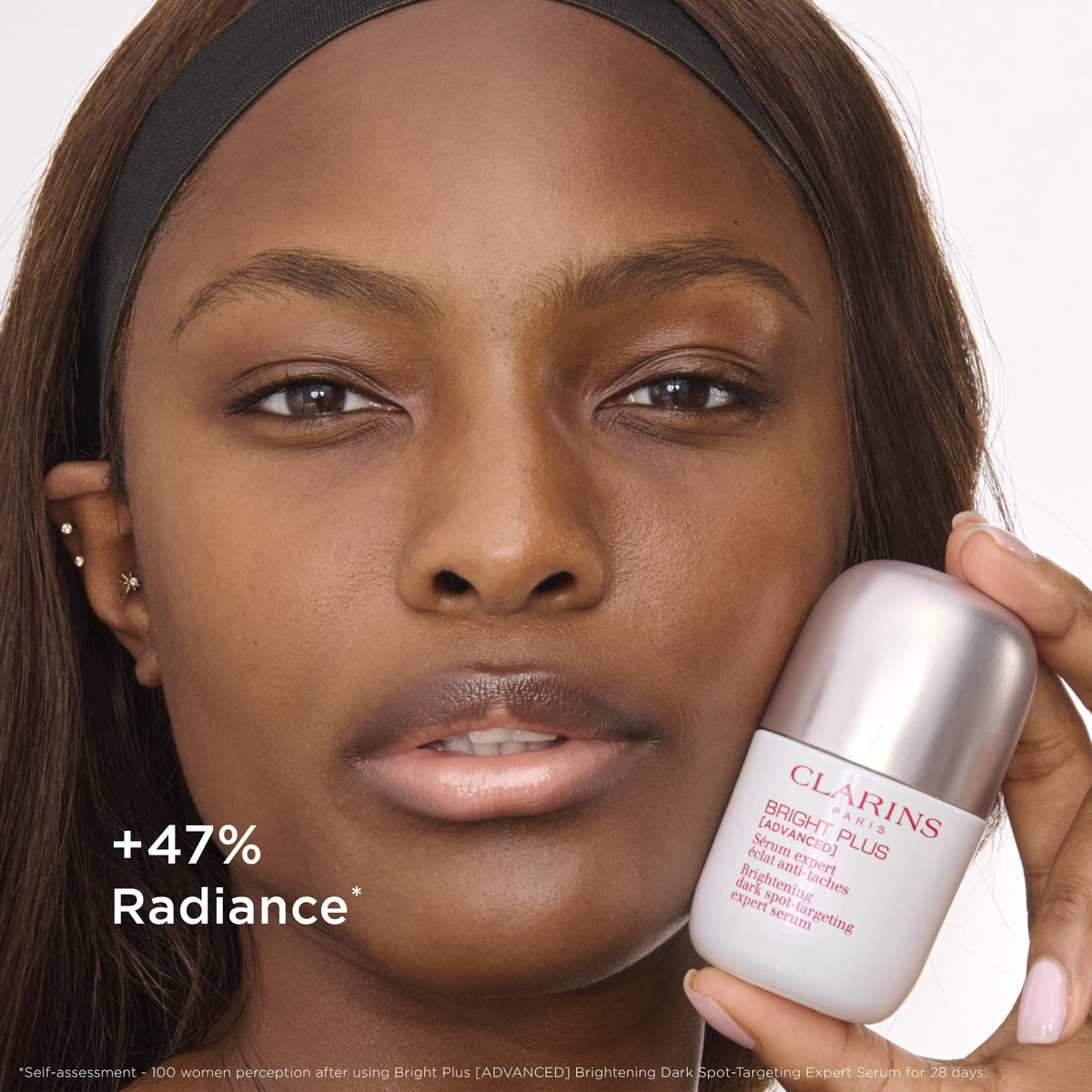 Clarins bottle staged with morning skincare items for routine inspiration