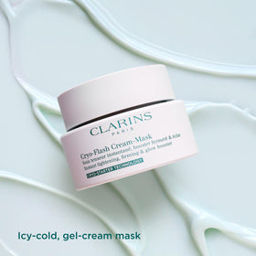 CLARINS mask removed with tissue showing simple post-treatment cleanup benefit