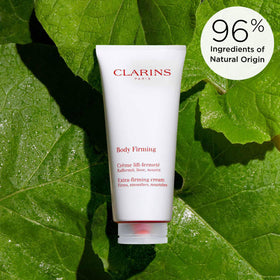 Clarins tube beside a hand for scale indicating convenient 6.6 ounce size