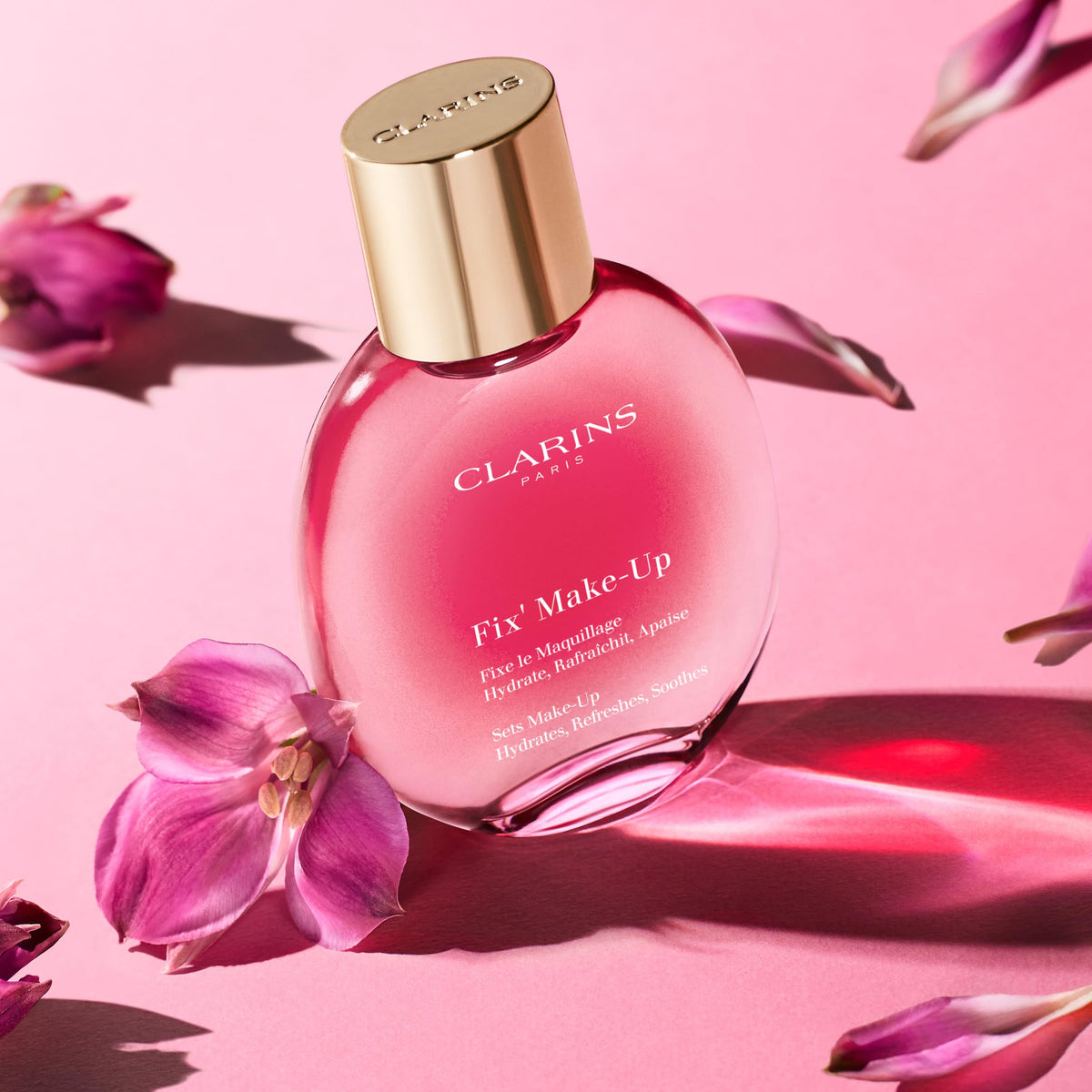 Clarins makeup spray applied to model face for instant refresh benefit