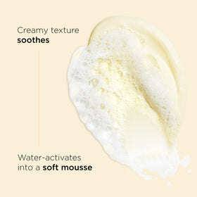 Clarins foam texture on hand demonstrating soft, creamy lather benefit