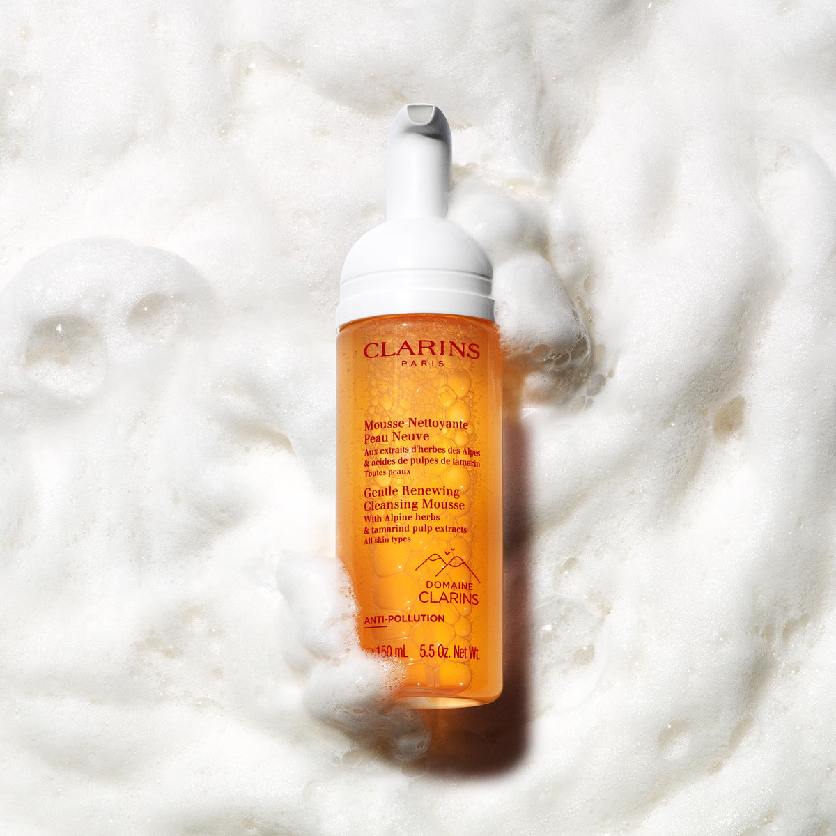 Clarins 5.5 oz bottle next to ruler for clear size and travel-friendly benefit