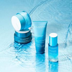 Clarins Hydra‑Essentiel bedside lifestyle scene conveying restful overnight repair