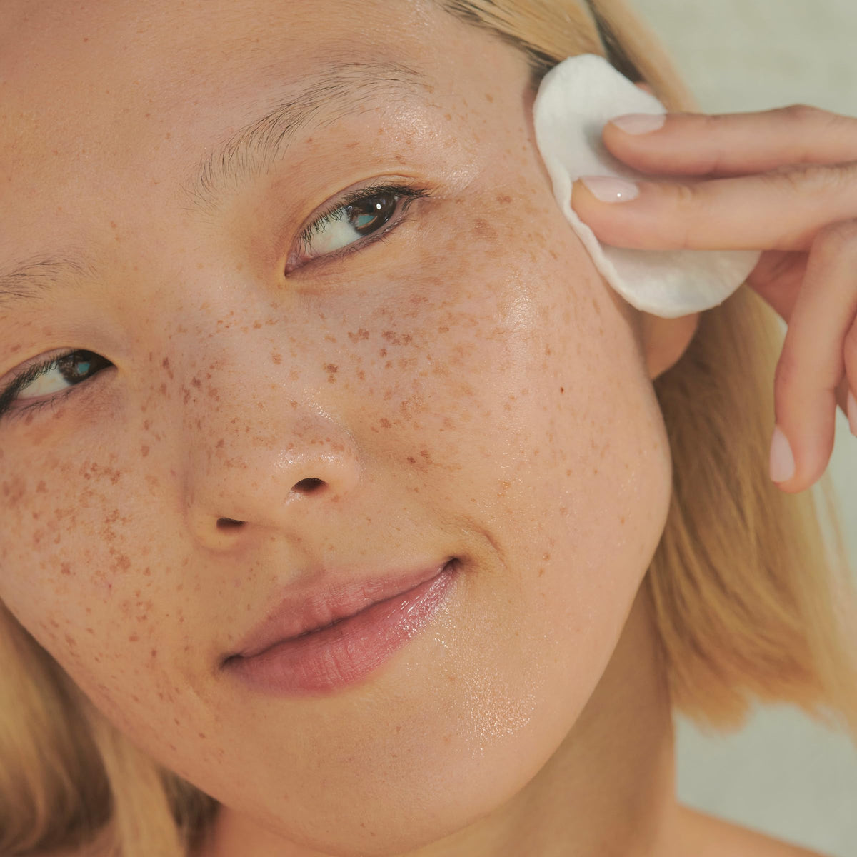 CLARINS toner on cotton pad demonstrating easy residue removal