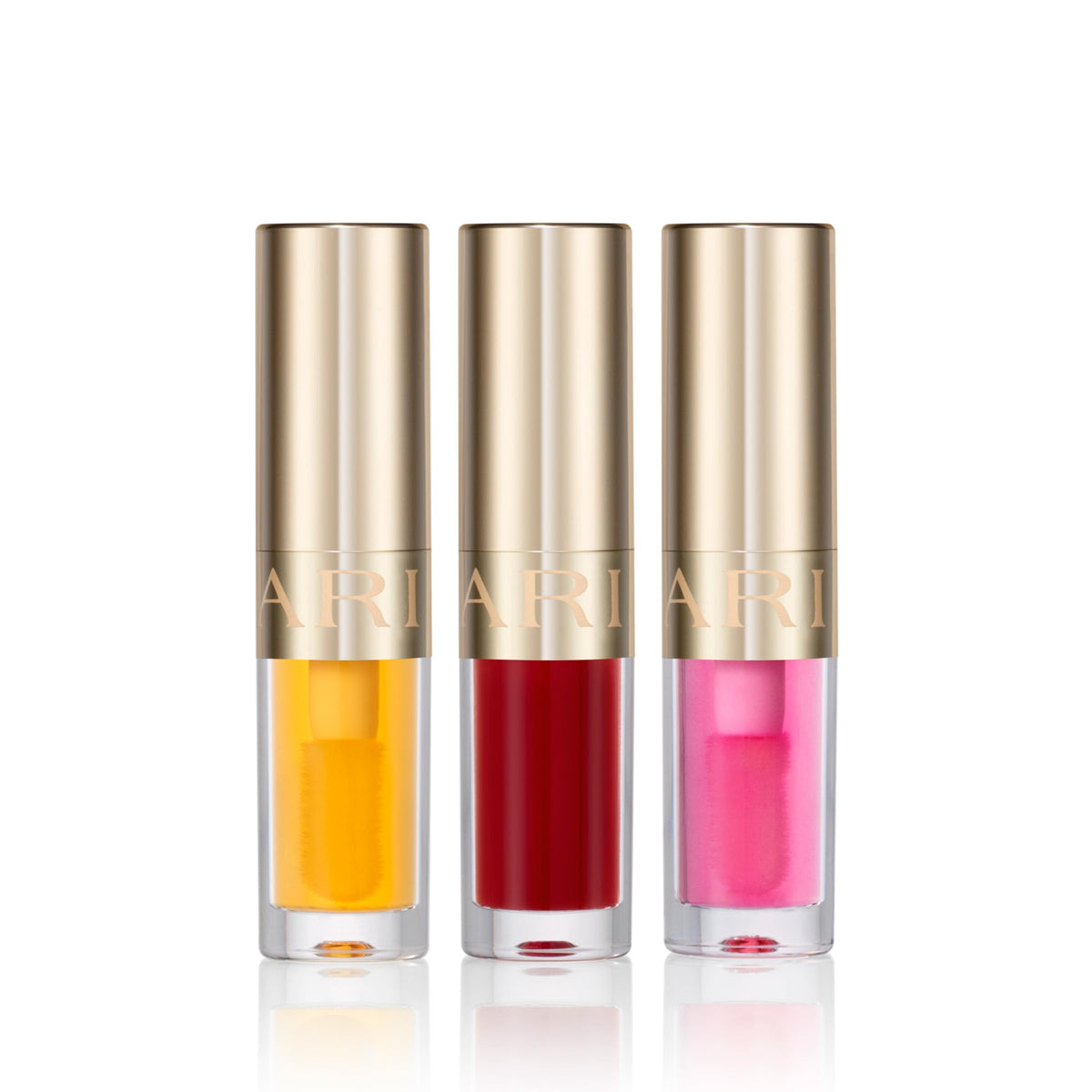 CLARINS three mini lip oils displayed to show shades and sheer color payoff