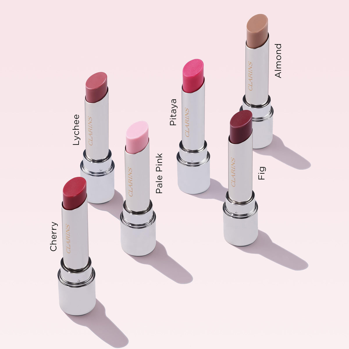 Clarins balm layered over matte lipstick adding gloss and comfort benefit