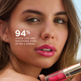 Clarins lip oil beside a lipstick for scale and layering versatility