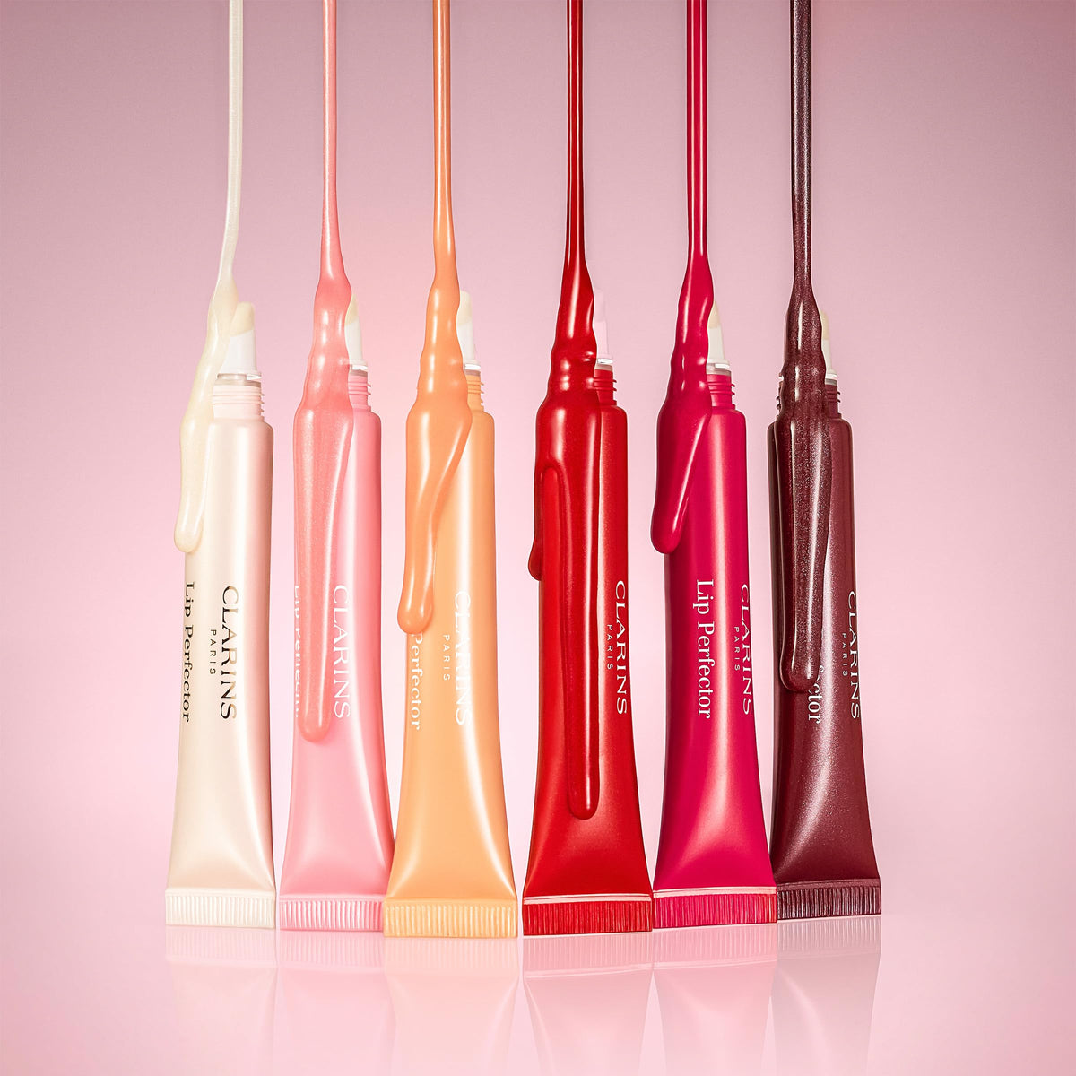 CLARINS size comparison next to coin for portability