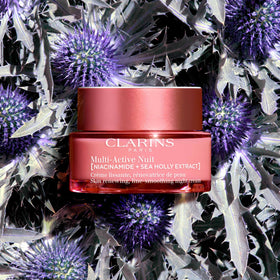 Clarins application on hand demonstrating press-and-release method, improves absorption