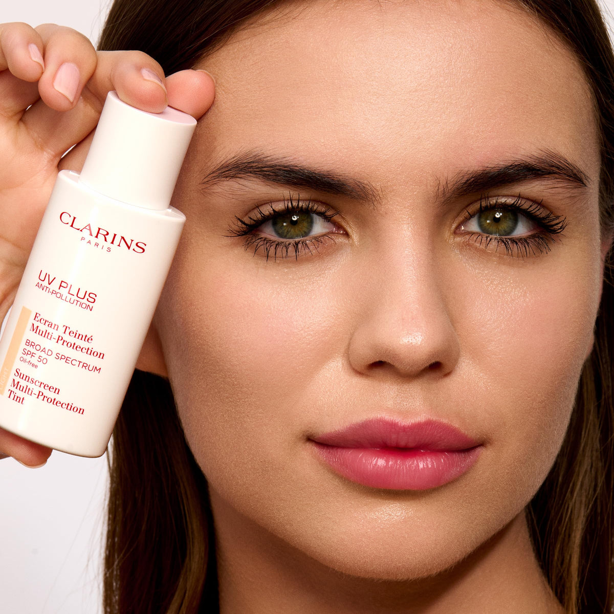 Clarins sunscreen in a bathroom routine setting demonstrating daily use