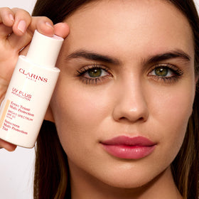 Clarins sunscreen in a bathroom routine setting demonstrating daily use