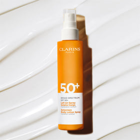 CLARINS sunscreen bottle inside a travel bag showing compact 5‑ounce size for on‑the‑go use