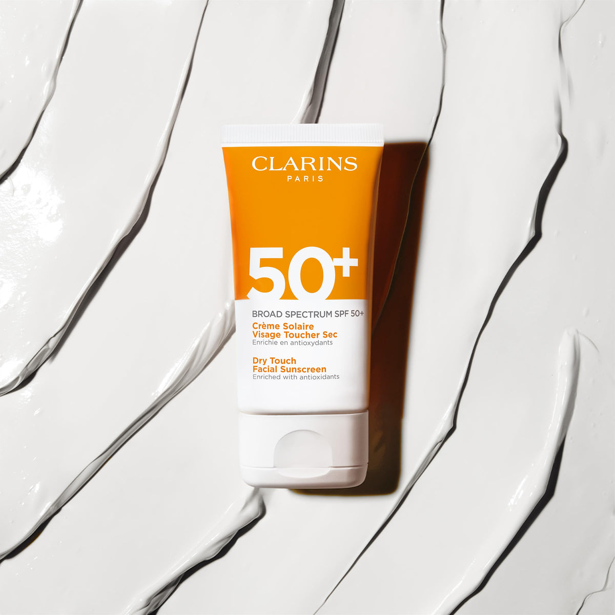Clarins tube in hand for scale showing travel-friendly 1.7 ounce benefit