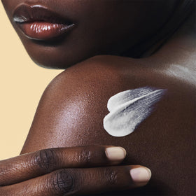 CLARINS sunscreen in a beach setting illustrating outdoor protection and active lifestyle use