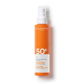 CLARINS front packaging of SPF 50+ body sunscreen spray showing size and branding, easy travel benefit