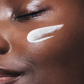 Clarins sunscreen applied under makeup showing seamless layering benefit