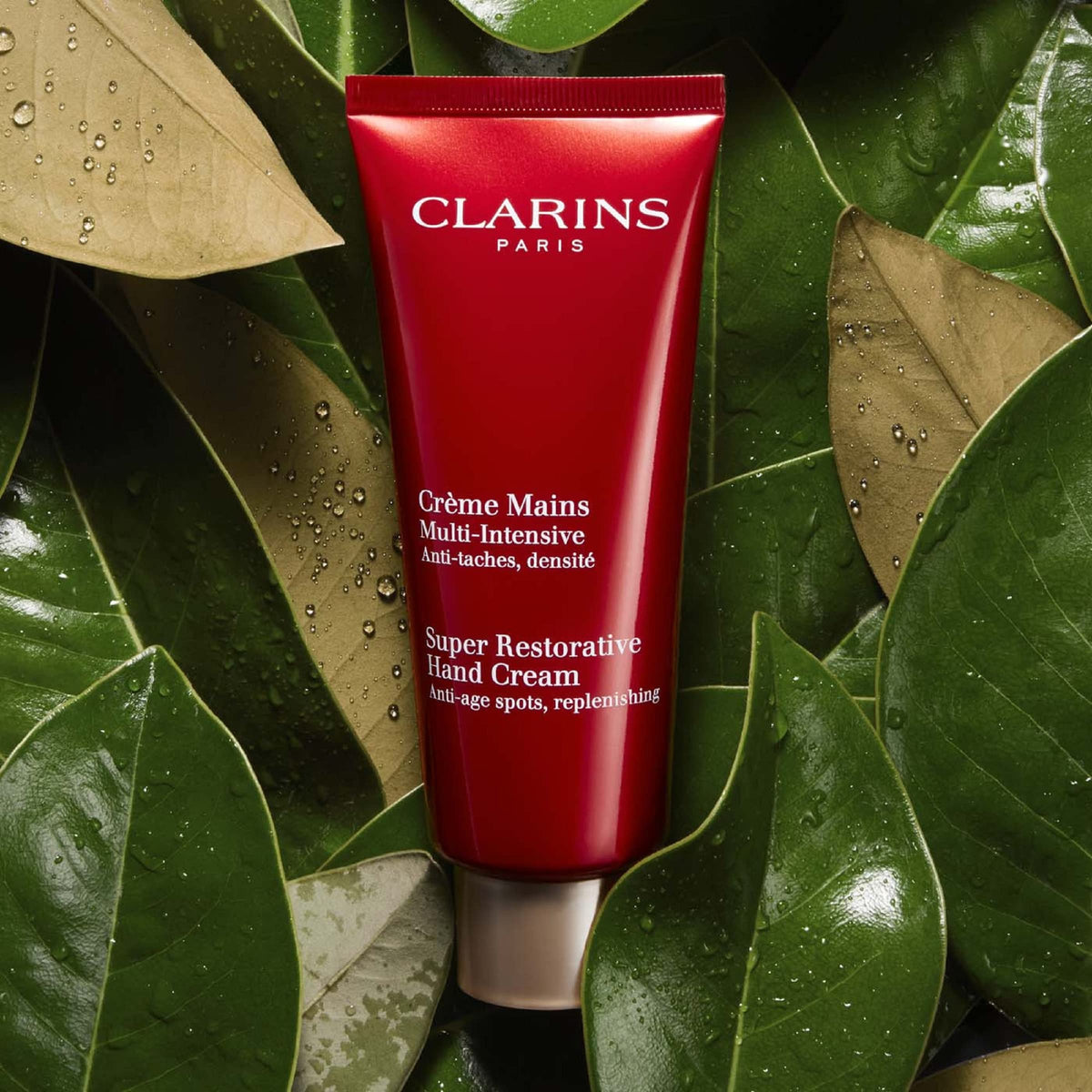 Clarins hand cream in use applied to hands for visible softness