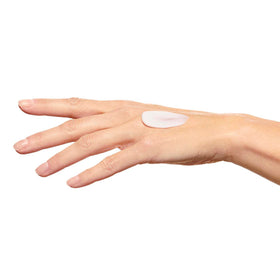 Clarins hand cream next to common items showing product size