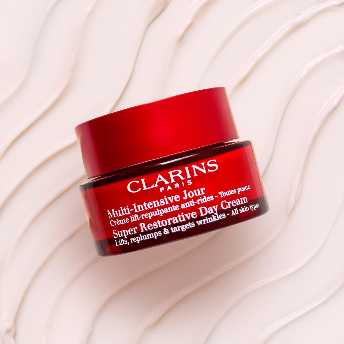 Clarins Harungana extract ingredient closeup, emphasizes firming benefit