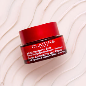 Clarins Harungana extract ingredient closeup, emphasizes firming benefit
