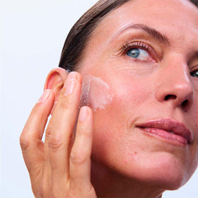 Clarins product label closeup, displays active ingredients and clarity