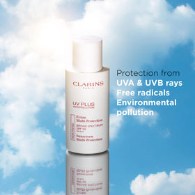 Clarins tube held in hand for scale to show travel-friendly size and portability