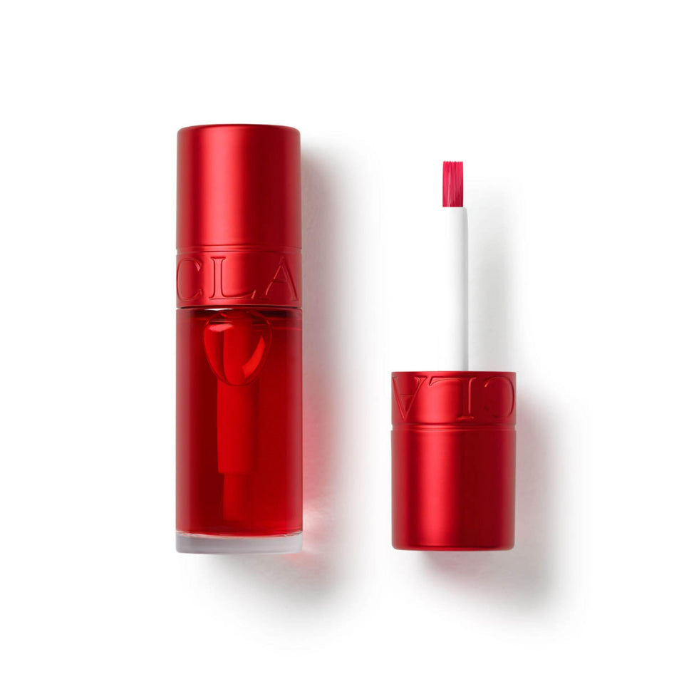 Clarins tube front view showing red shade and compact design benefits