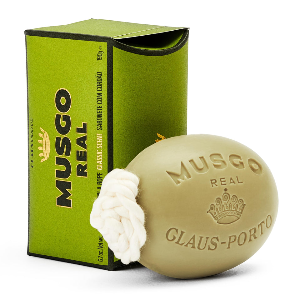 Claus Porto soap on a rope front packaging showing woody fragrance and hanging benefit