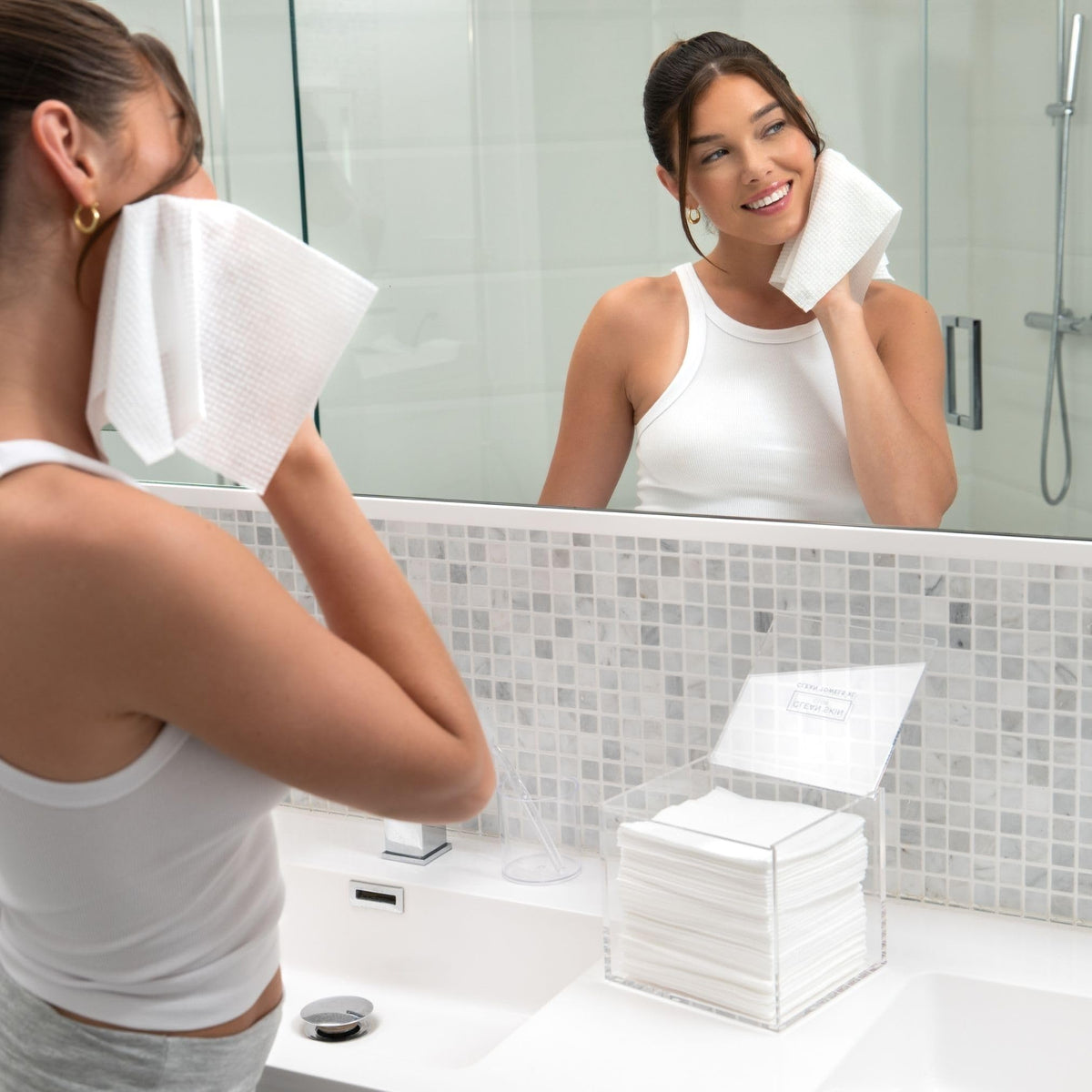 CLEAN SKIN CLUB acrylic box on bathroom vanity creating tidy, water-resistant storage