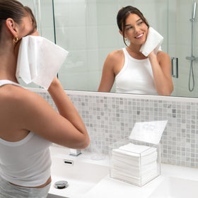 CLEAN SKIN CLUB acrylic box on bathroom vanity creating tidy, water-resistant storage