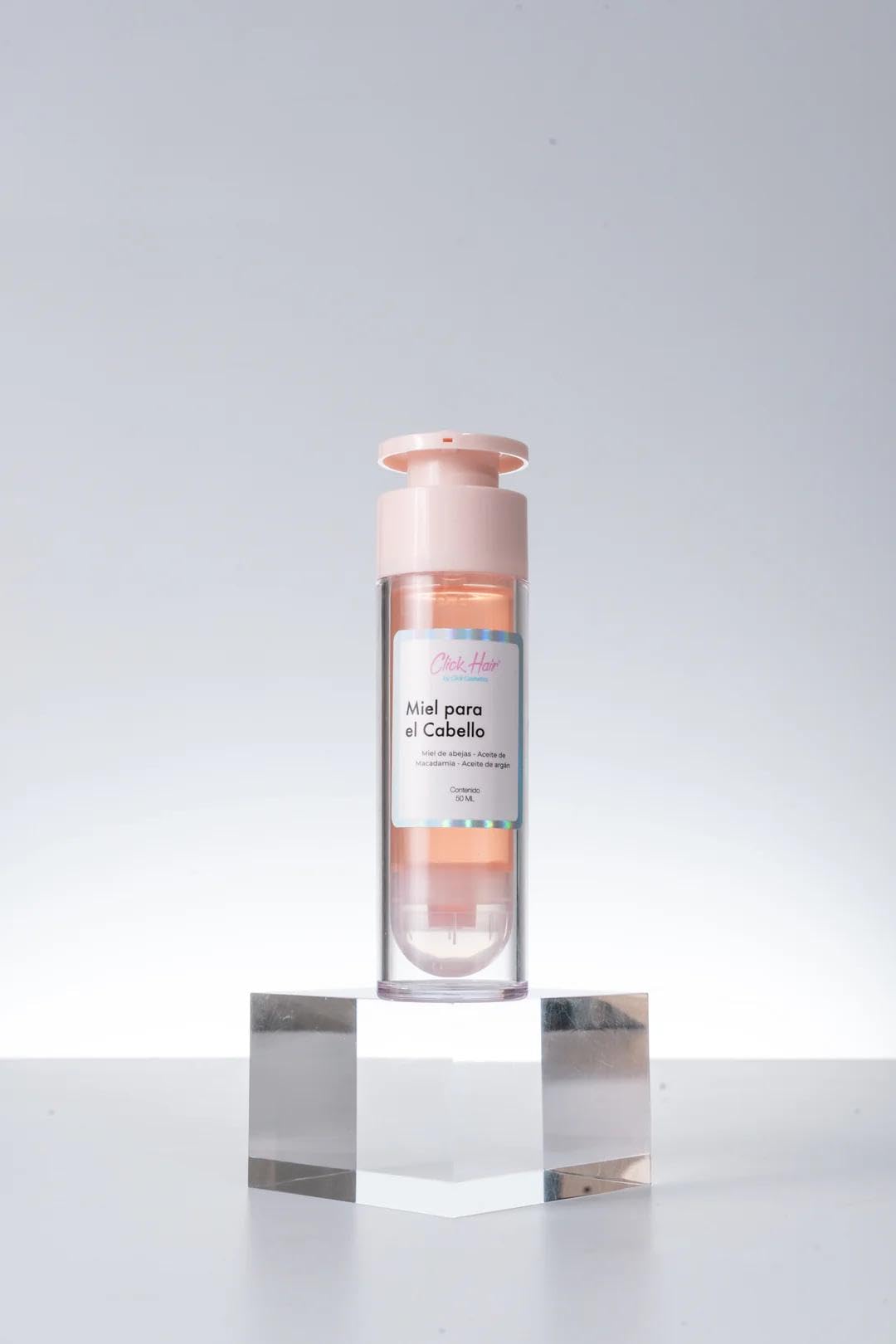 Click Hair 50ml bottle beside scale for size and travel-friendly convenience