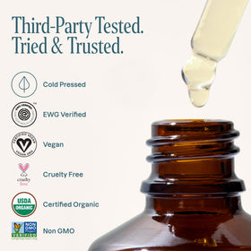 Cliganic argan oil on hand demonstrating facial absorption and hydration