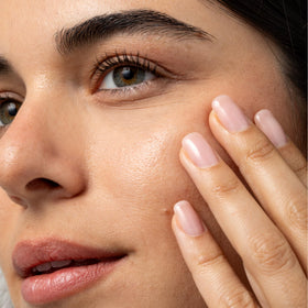 Cliganic oil texture on skin illustrating lightweight absorption benefit