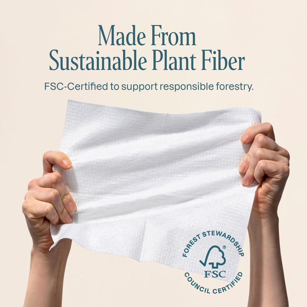 Cliganic towel held in hand to show XL size and practical scale for use