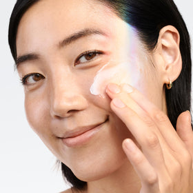Clinique application on cheek illustrating smooth spread and even coverage benefit