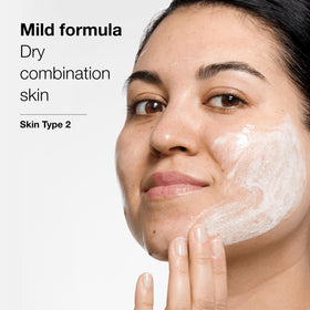 Clinique bottle label detail highlighting ingredients and dermatologist-developed benefit