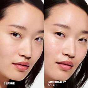 Clinique bottle label close-up highlighting key ingredients for visible glow