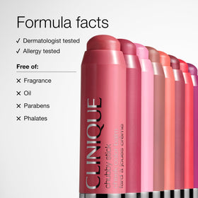 Clinique size comparison beside coin to show travel-friendly portability