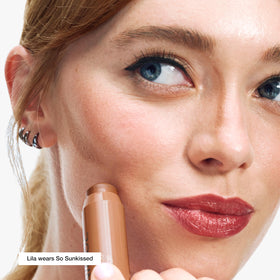 Clinique Chubby Stick in hand to show scale and convenient travel size benefit