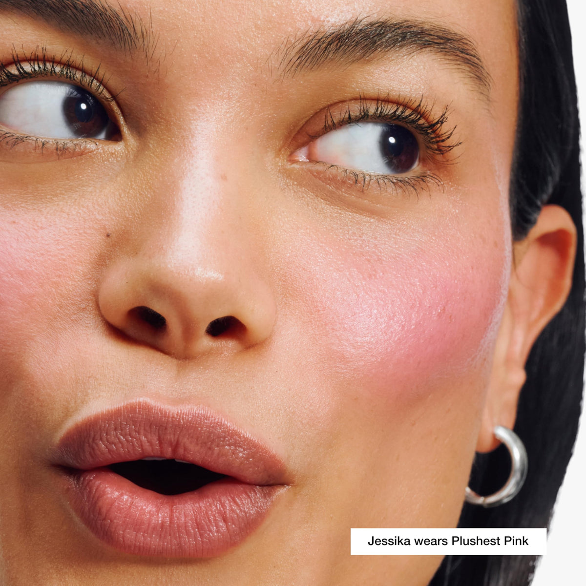 Clinique chubby stick texture swiped on skin displaying sheer glossy tint and hydration