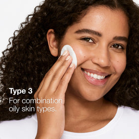 Clinique Clarifying Lotion 3 pouring into cotton pad demonstrating simple application benefit