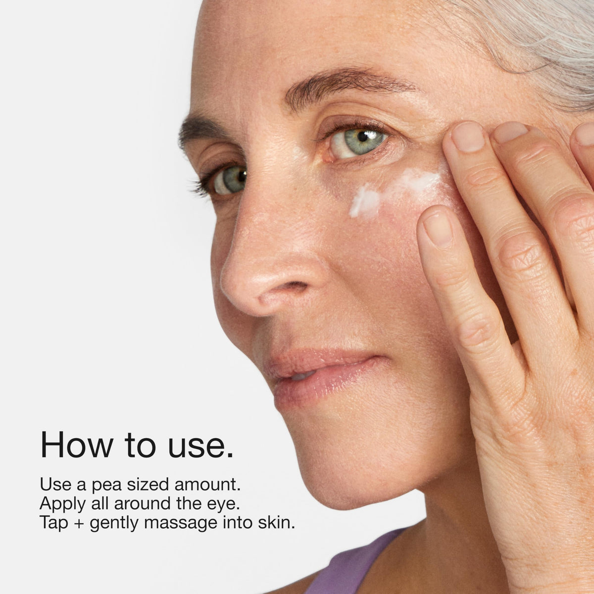 Clinique applying cream under eye illustrating gentle massage to reduce puffiness
