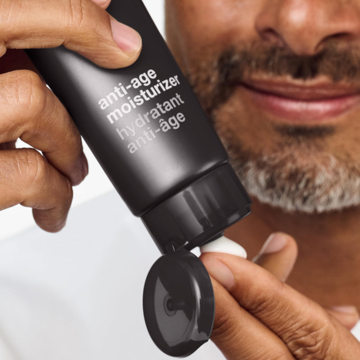 Clinique cream on fingertip demonstrating smooth, non-greasy texture for quick layering