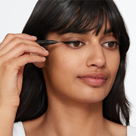 Clinique application on eye creating a clean winged liner with control