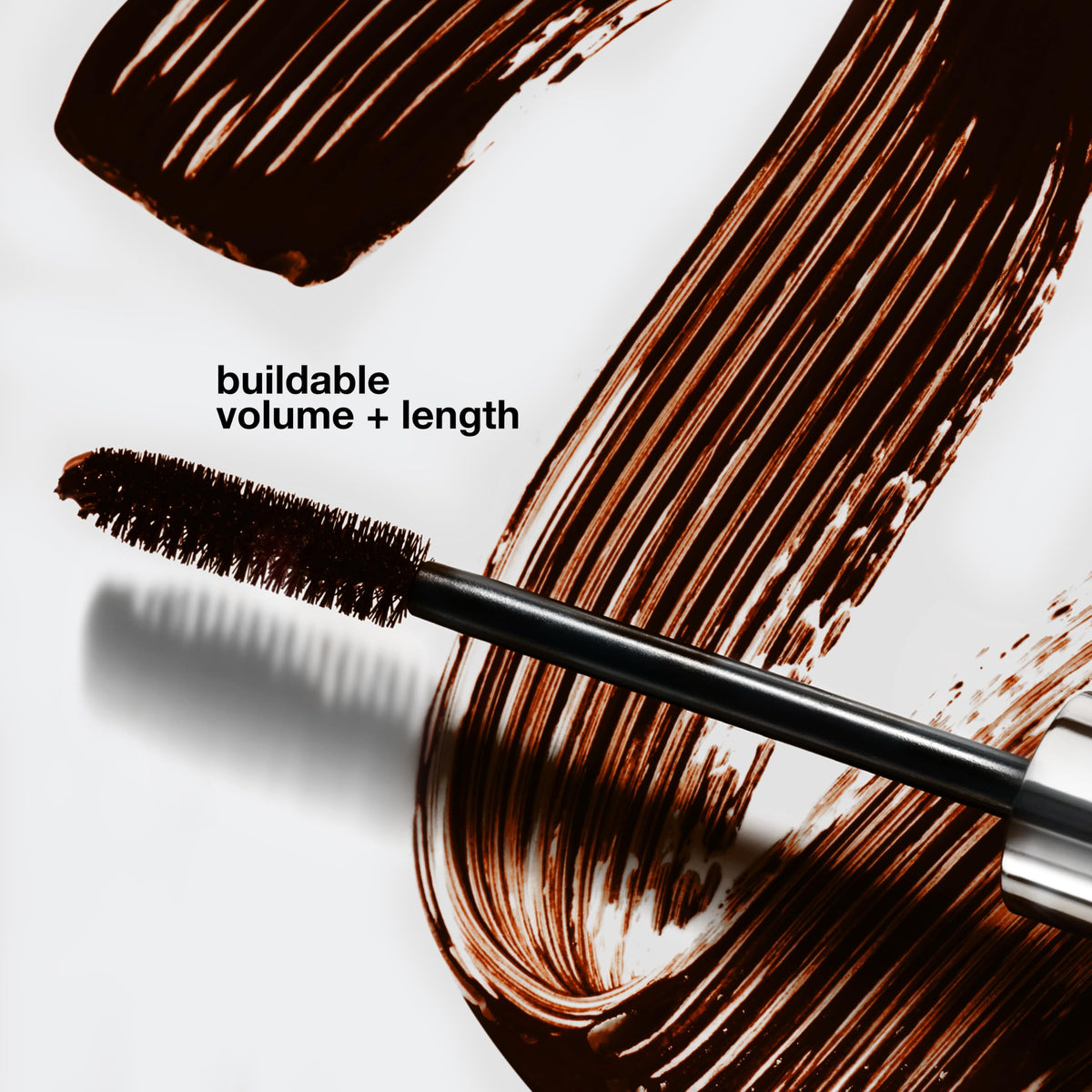 Clinique mascara texture swatch on skin, demonstrating smooth buildable coverage benefit