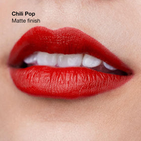 Clinique Chili Pop lip swatch on arm illustrating true-to-tone color