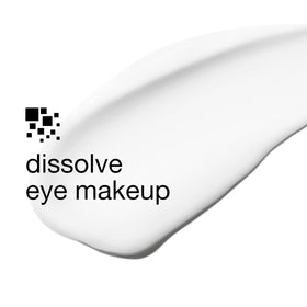 Clinique product in use on cotton pad removing mascara, reduces rubbing