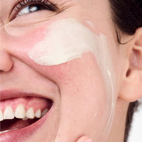 Clinique applying cream on hand to show easy absorption benefit